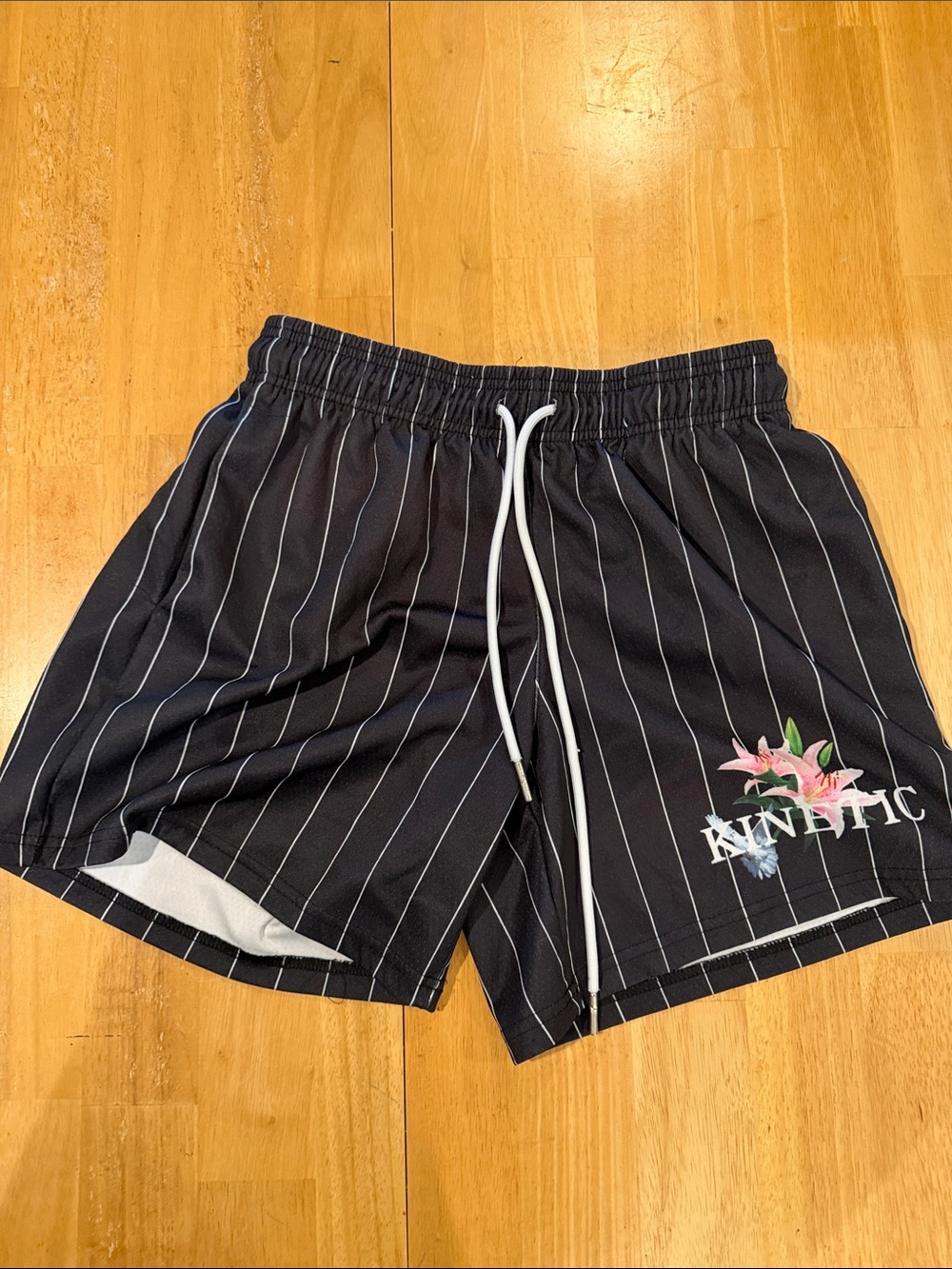 Kinetic Black Pinstripe  Shorts with Floral Logo